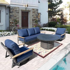 Manbo 4-Piece Wicker Patio Fire Pit Seating Set with Acrylic Spectrum Indigo Cushions and Round Fire Pit Table