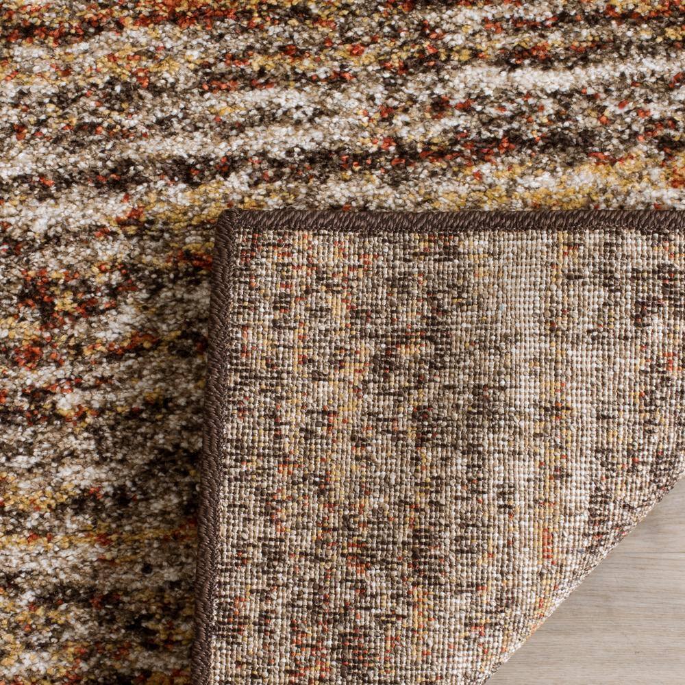 Ivory and Gold Abstract Shag Synthetic Area Rug 4' x 6'