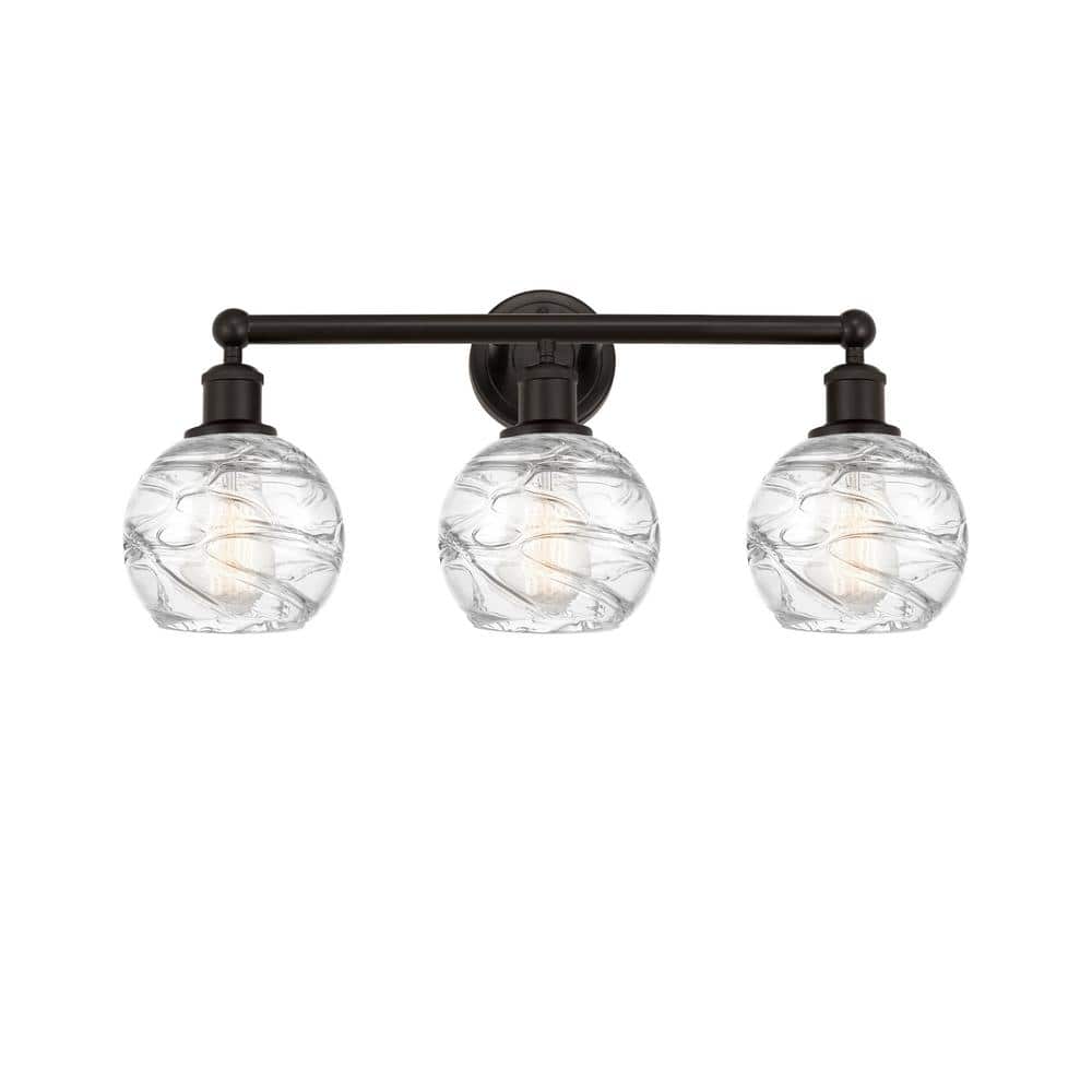 Athens Deco Swirl 24 in. 3-Light Oil Rubbed Bronze, Clear Deco Swirl Vanity Light with Clear Glass Shade price history on PriceWatchPro
