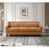 Tufted leather sofa in a decorated room.
