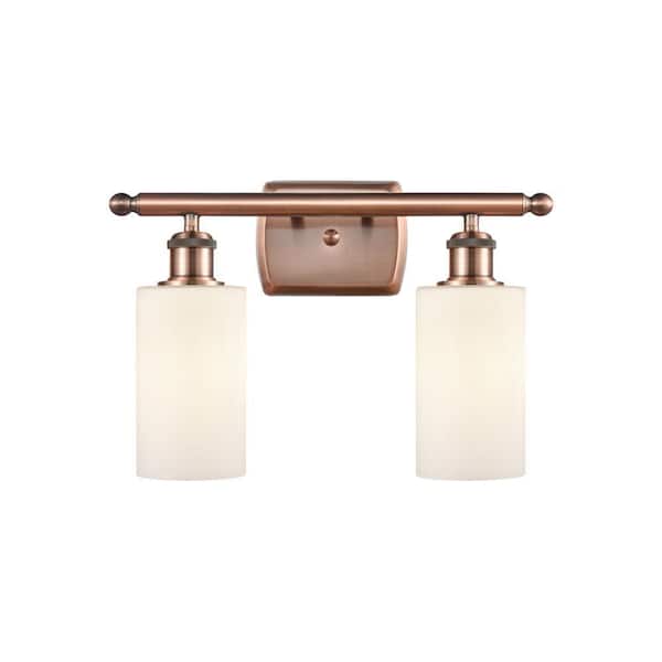 Clymer 16 in. 2-Light Antique Copper Vanity Light with Matte White Glass Shade