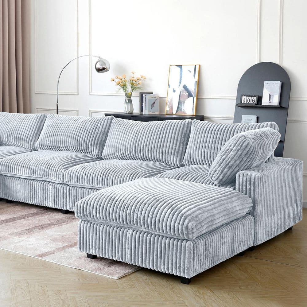 Gray L-shaped modular sofa on a plain background.