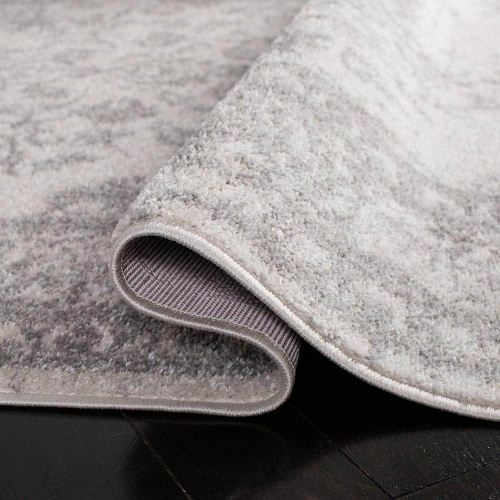 Chic Ivory & Silver 6' Round Synthetic Easy-Care Area Rug