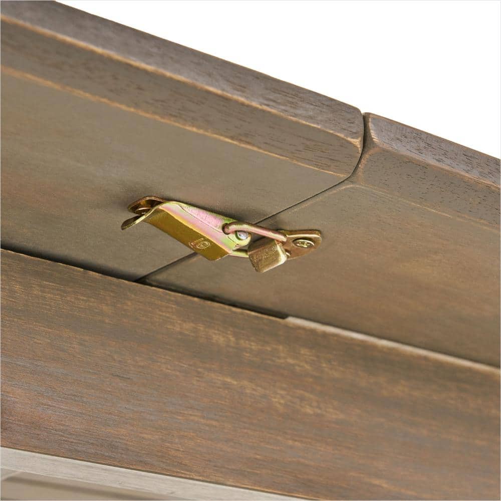 Close-up of the metal expansion mechanism on the acacia wood table.