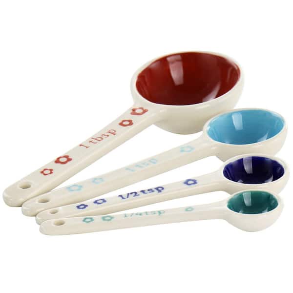 https://images.thdstatic.com/productImages/d12bd05c-65f7-4b55-bc7e-efc90ce224a1/svn/white-gibson-home-measuring-cups-measuring-spoons-985118956m-4f_600.jpg