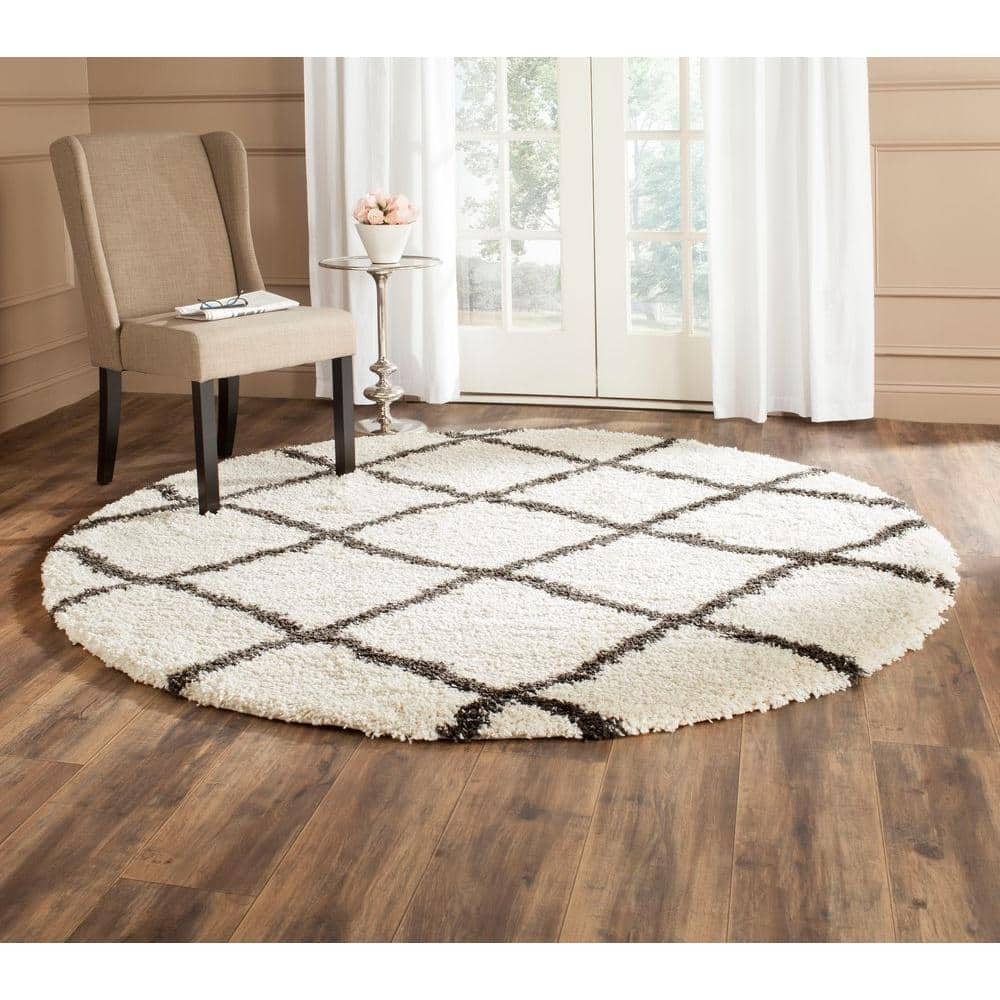 https://images.thdstatic.com/productImages/d1584442-f1d1-4066-8f26-15ddd04d9196/svn/ivory-charcoal-safavieh-area-rugs-sgb489b-6r-64_1000.jpg