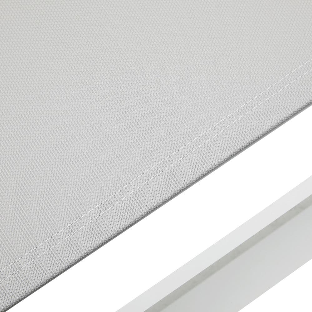 Close-up detail of the woven mesh fabric on the chaise lounge surface.