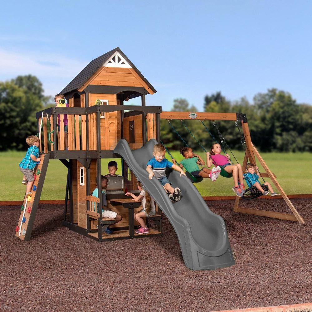 Backyard Discovery Canyon Creek Outdoor Kid's Playground Set w/ Rockwall, Upper Fort, Swing Set, Gray Wave Slide, and PlaySet Kitchen