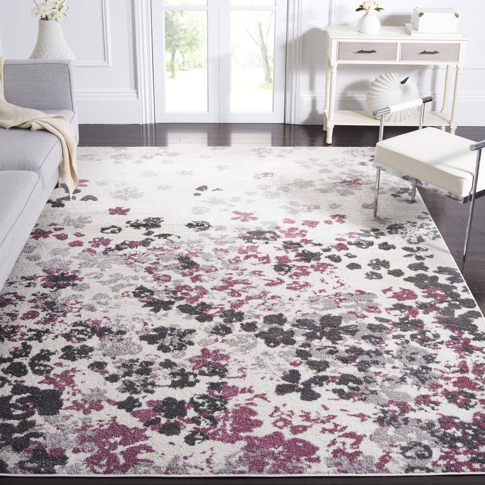 Ivory and Purple Floral Synthetic 10' x 14' Area Rug