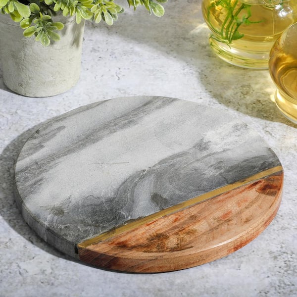 Round marble ceramic cutting board. Marble trivet in white or black with  gold veins and leather chord. Cheese serving tray slab to display with