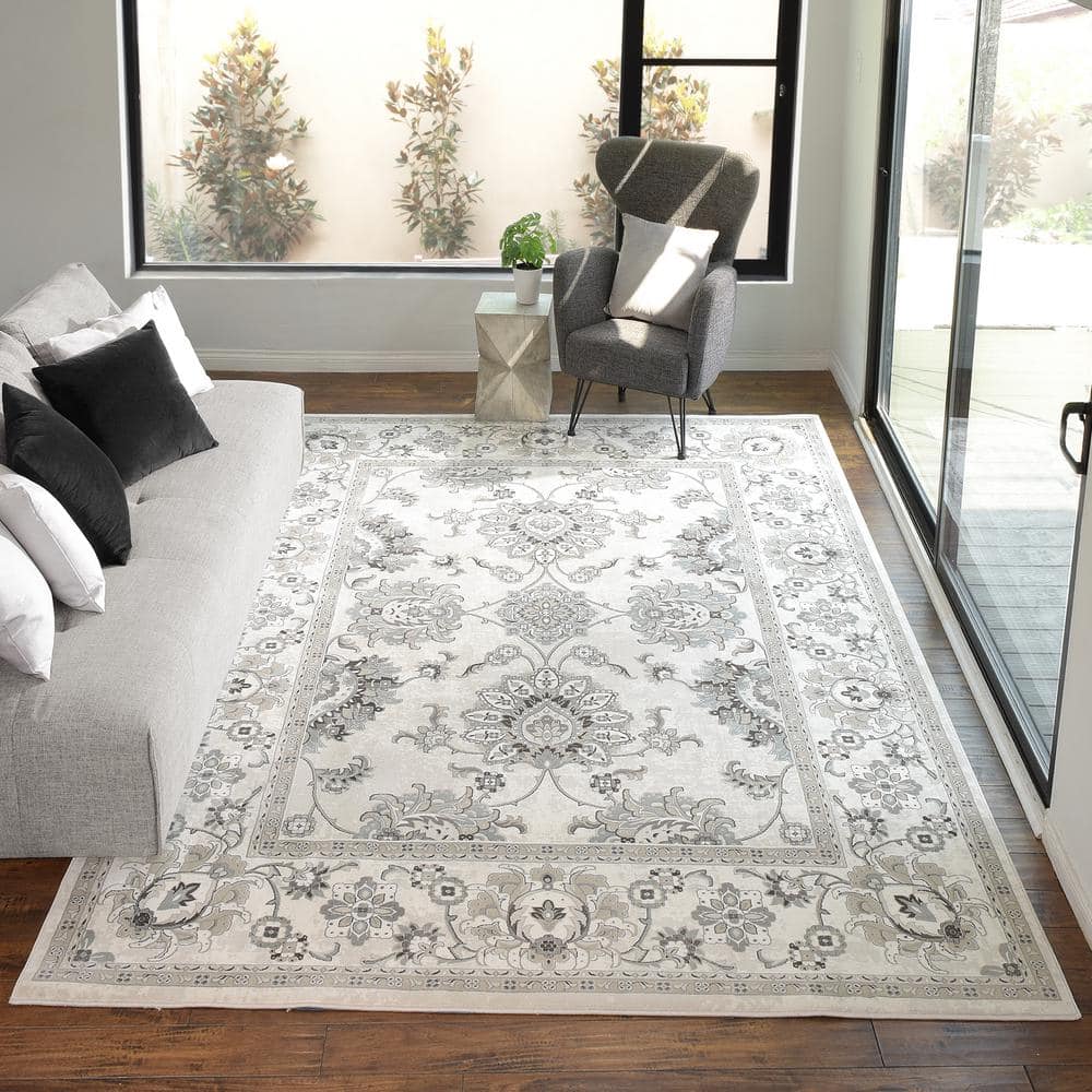 Ivory and Gray Tufted Synthetic 6' x 9' Area Rug