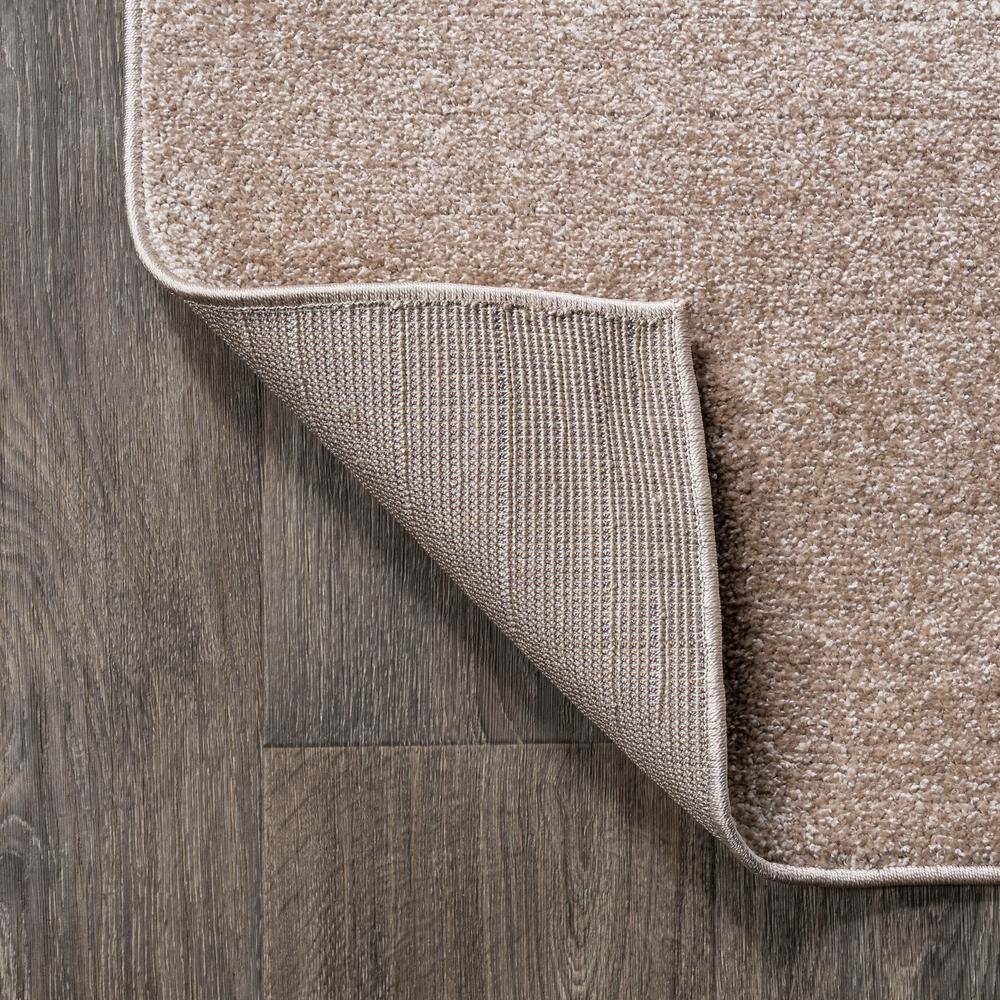 Beige 12' x 15' Solid Synthetic Low-Pile Area Rug