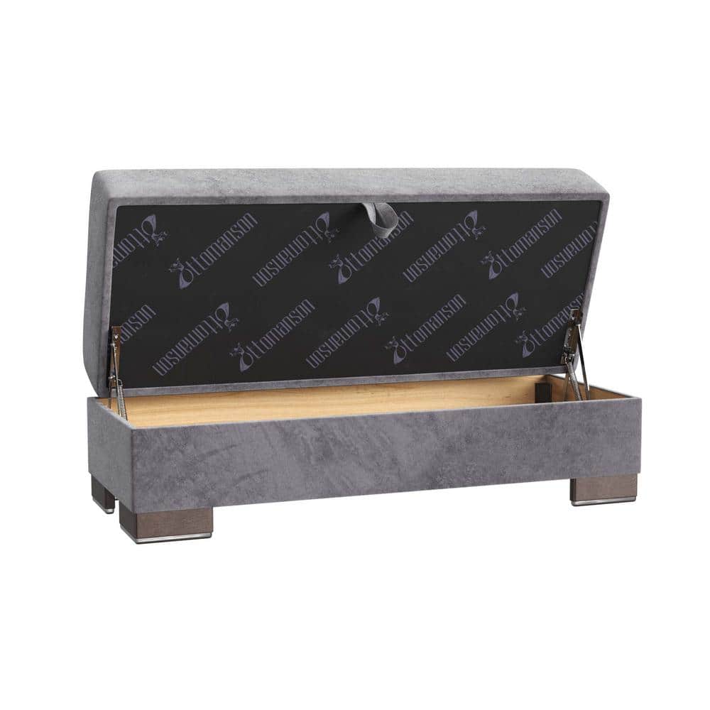 Open gray microfiber storage ottoman showing interior storage space.