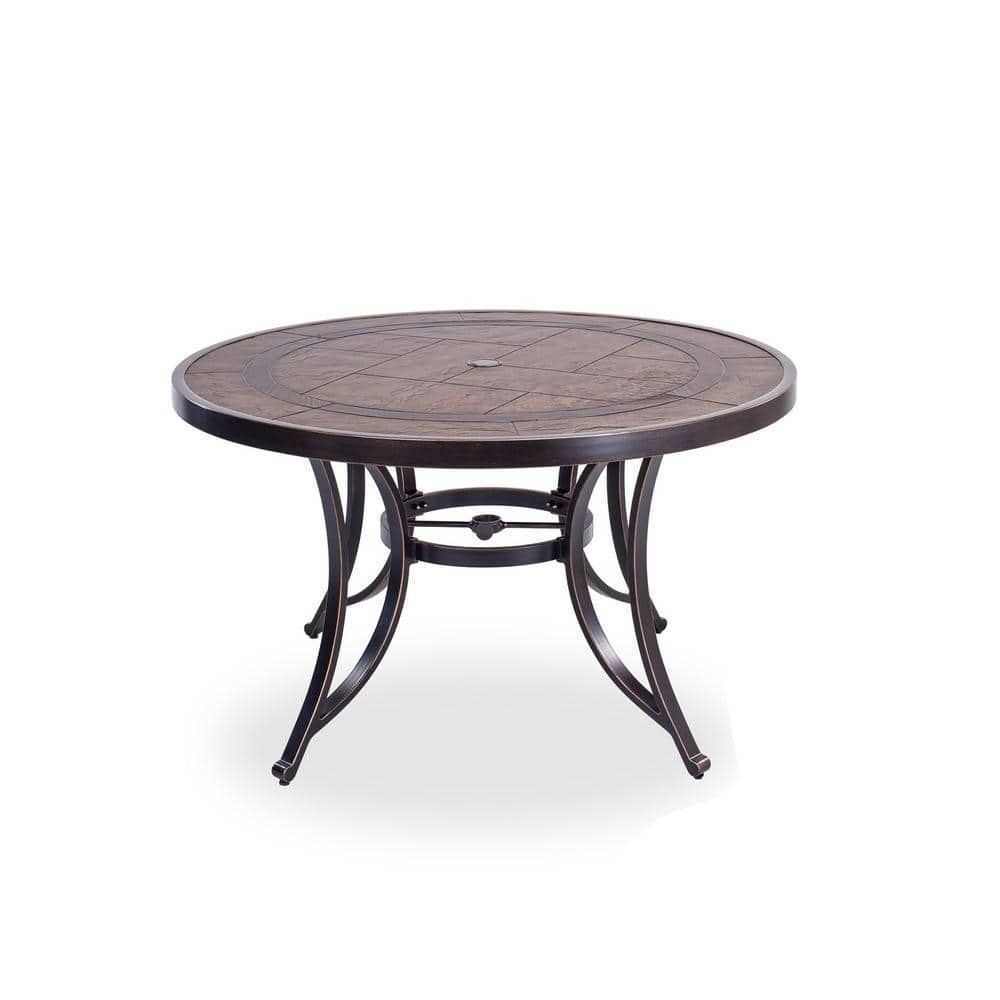Round dark brown aluminum outdoor dining table with a faux wood top.