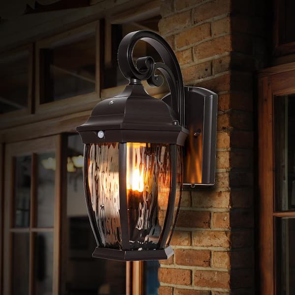 16.1 in. Bronze Integrated LED Motion Sensing Dusk to Dawn Hardwired Outdoor Wall Light Lantern Sconce, Flickering Bulb