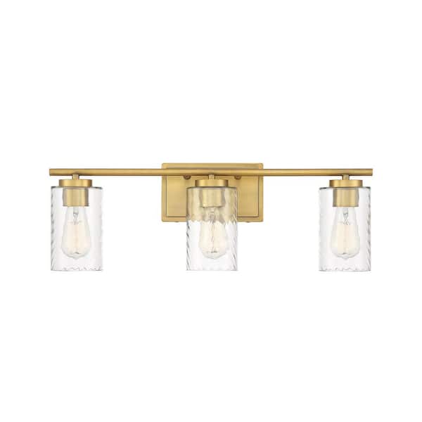 TUXEDO PARK LIGHTING 24 in. W x 8.63 in. H 3-Light Natural Brass Bathroom Vanity Light with Clear Cylinder Glass Shades