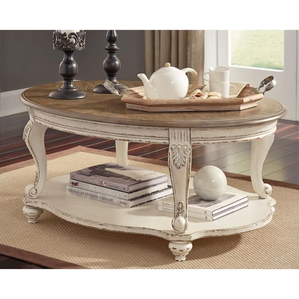 Realyn 48 In. White/Brown Oval Wood Coffee Table with Shelf
