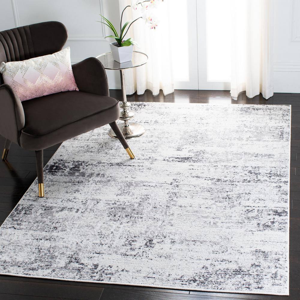 Ivory and Grey Abstract Round Synthetic Rug, 3' x 5'