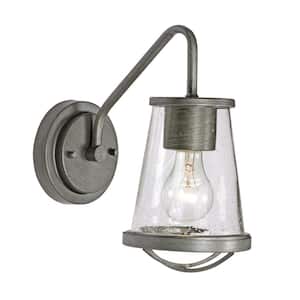 Darby 5.75 in. 1-Light Weathered Iron Industrial Wall Sconce with Clear Seeded Glass Shade