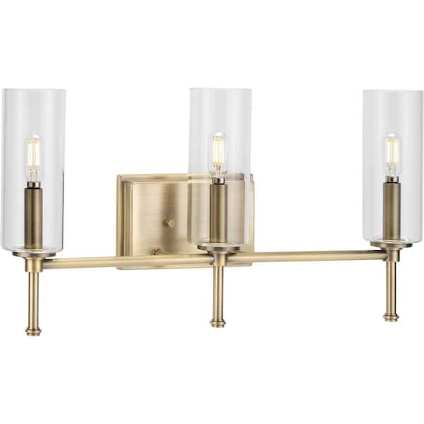 Elara 22.12 in. 3-Light Vintage Brass Vanity Light Clear Glass New Traditional Bath