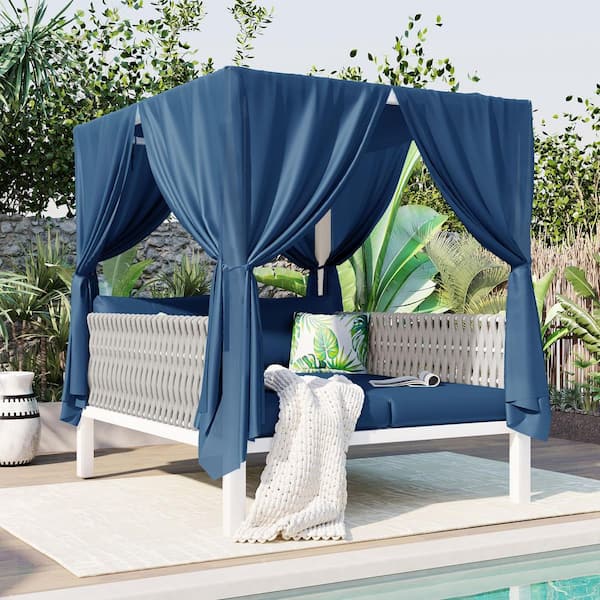 Rubber Core Rope Wicker Outdoor Day Bed with Blue Cushions and Canopy Curtains