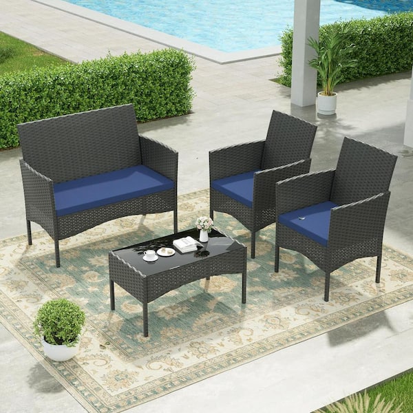Halmuz 4-Piece Wicker Patio Conversation Set with Tempered Glass Table and Navy Blue Cushion