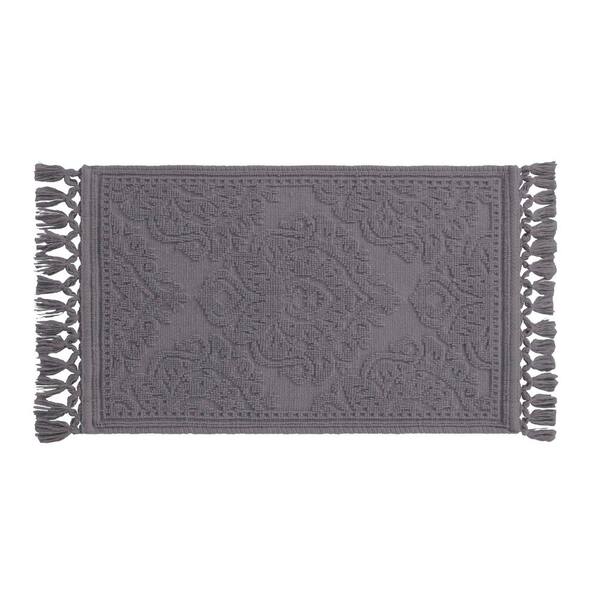 cambridge round tufted bath mat with tassels