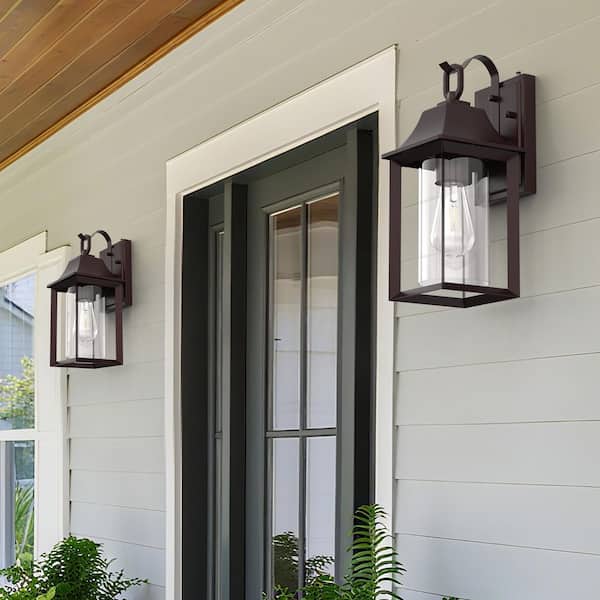 Decorators 14 in. Oil Rubbed Bronze Farmhouse Cylinder Dusk to Dawn Outdoor Hardwired Cylinder Glass Sconce