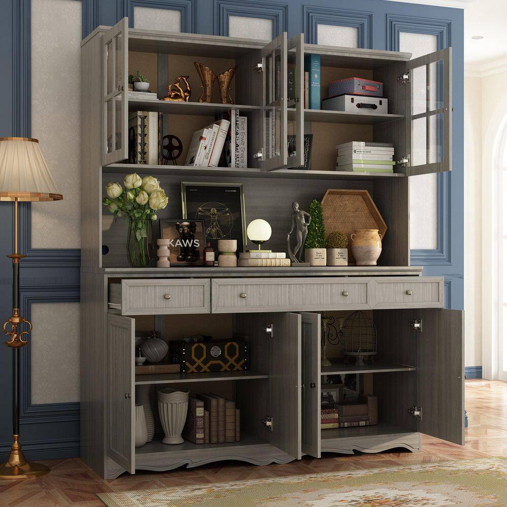 Open gray wooden buffet and hutch showing interior storage.