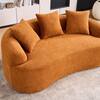 Orange chenille loveseat with pillows in a living room setting.