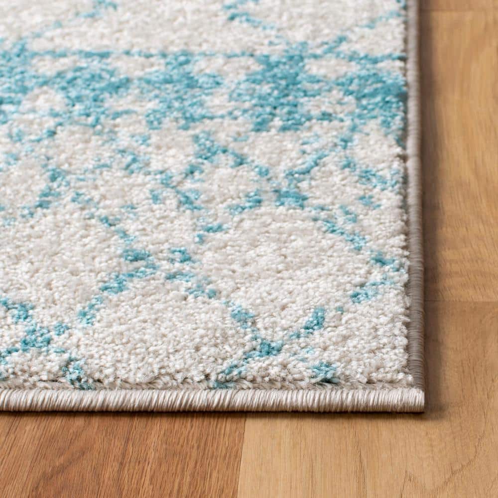 Ivory and Turquoise Moroccan Geometric 8' x 10' Area Rug