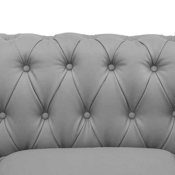 Wide leather couch of delicate grey color with large and small pillows  Stock Photo by Pressmaster