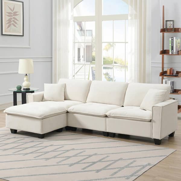 J&E Home 100 in. W Square Arm Suede L-shaped Convertible Sofa with Pillows and Ottoman in. Beige