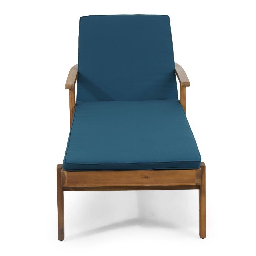 Front view of an acacia wood chaise lounge chair with a blue cushion.