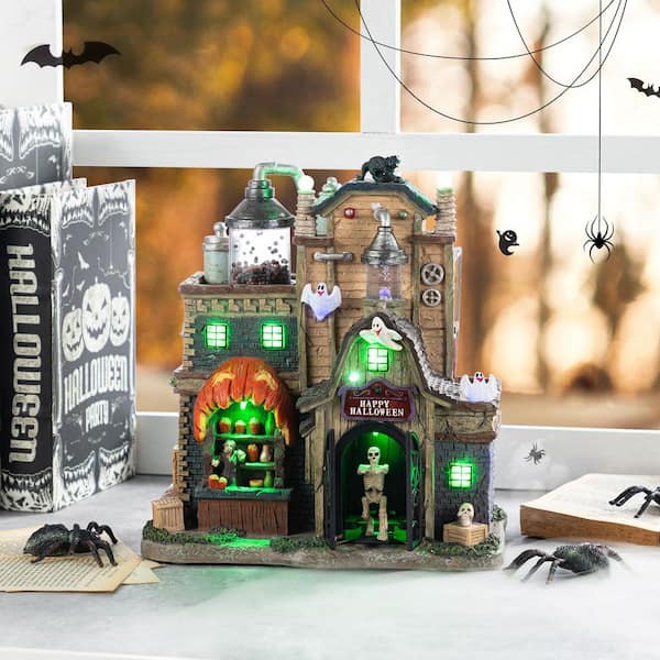 Glitzhome 11 in. H Lighted Resin Halloween Haunted House Village