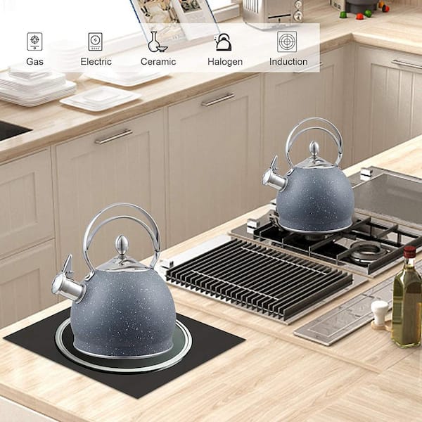 perfect kitchen accessory, a classic glass tea kettle sits atop