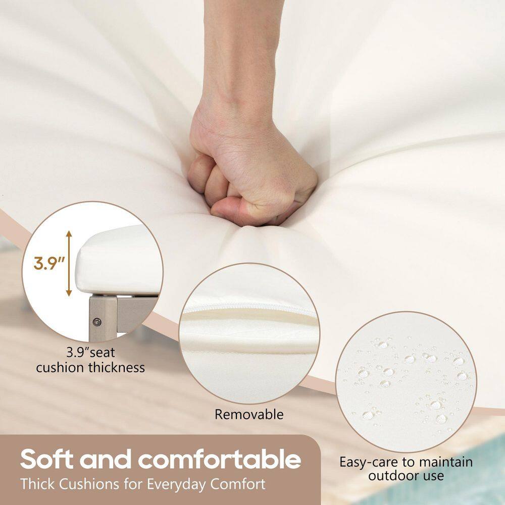 Close-up of a hand pressing into a thick white cushion.