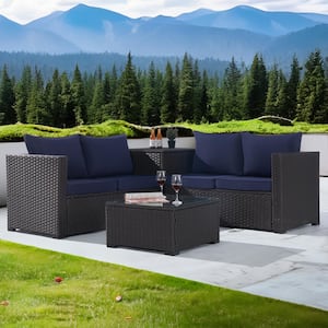 4-Piece Patio Rattan Sectional Sofa Set with Storage Box and Glass Coffee Table with Navy Blue Cushion