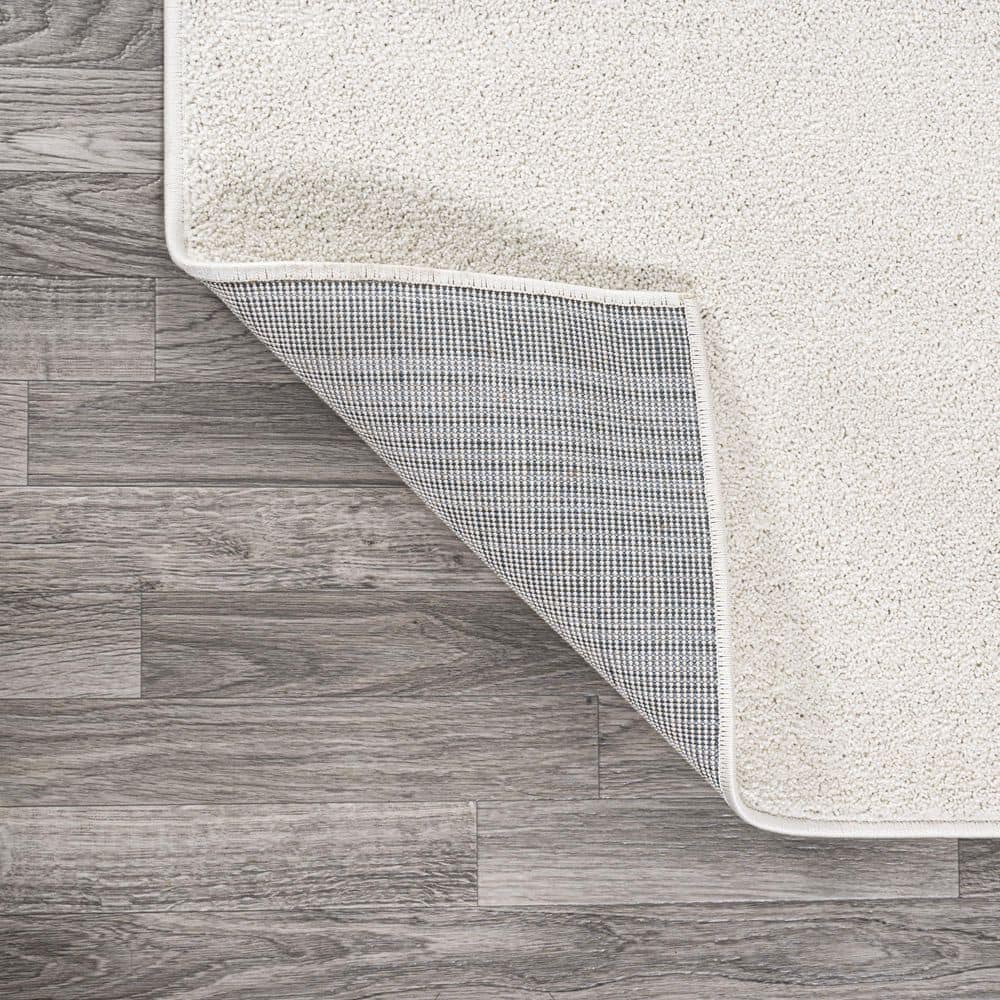 Cream Oval Low-Pile Synthetic Indoor Area Rug