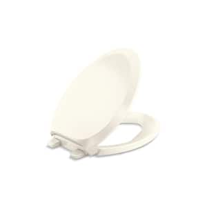 French Curve Elongated Closed Front Toilet Seat in Biscuit