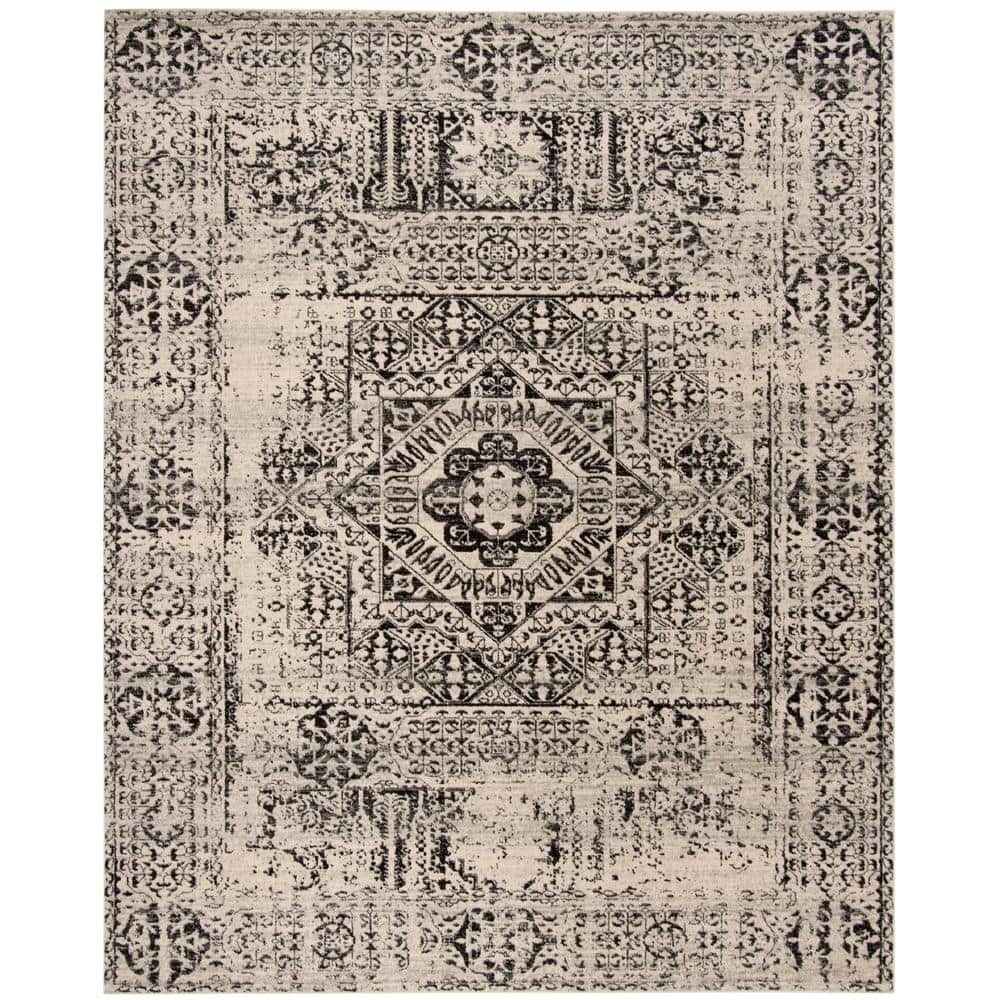 Ivory and Black Floral Motif Synthetic Area Rug