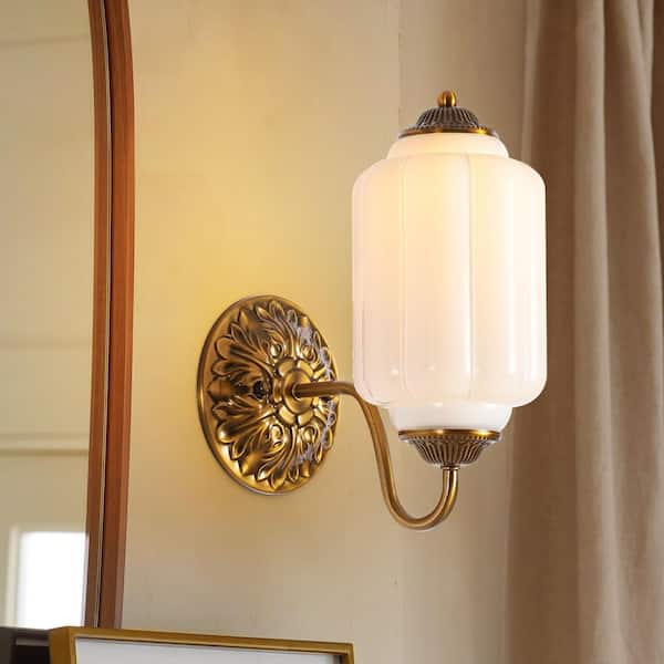 Amia 5.9 in. 1-Light French Country Antique Brass Cylinder Wall Sconce with White Pumpkin Glass Shade