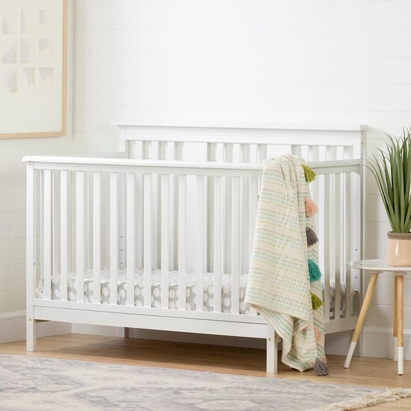 White crib shop with wood trim