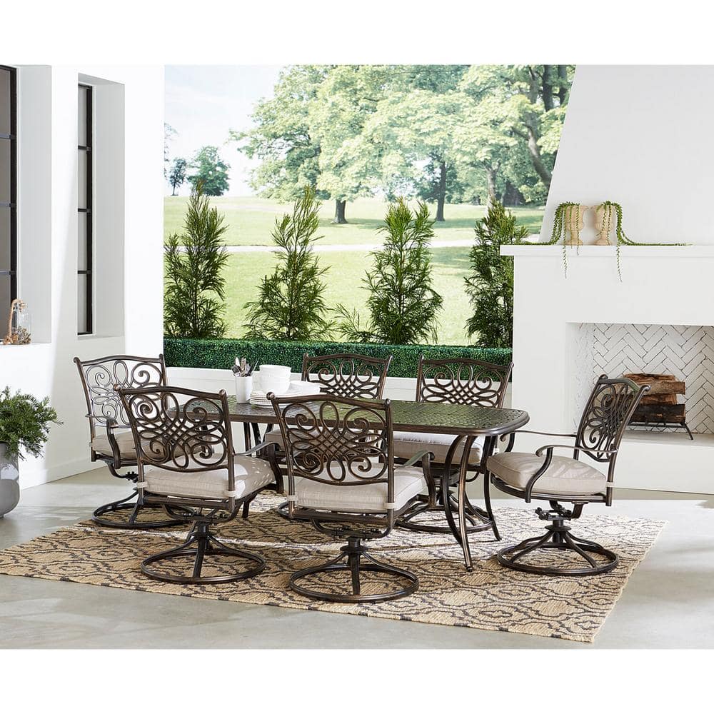 Bronze 7-Piece Outdoor Dining Set with Swivel Rockers and Cast-Top Table