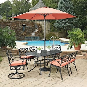 Sanibel Black 9-Piece Cast Aluminium Oval Outdoor Dining Set with Orange Coral Cushions and Umbrella