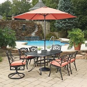 Sanibel Black 9-Piece Cast Aluminium Oval Outdoor Dining Set with Orange Coral Cushions and Umbrella