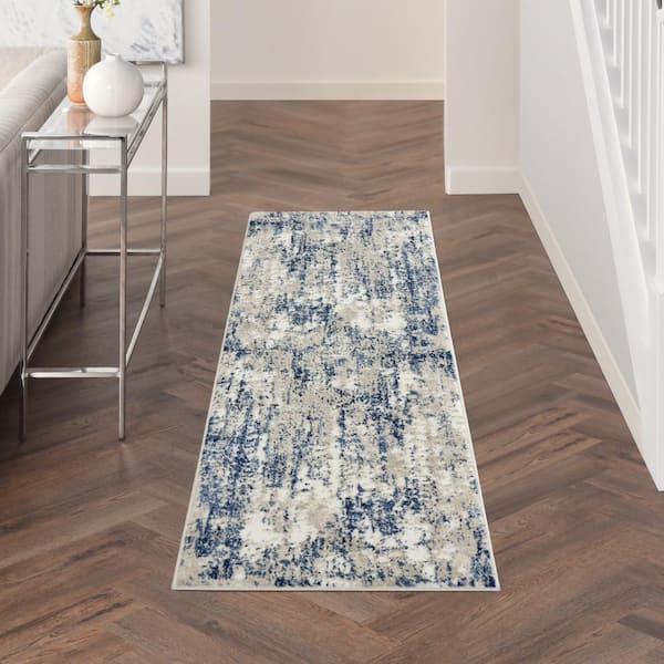 https://images.thdstatic.com/productImages/d6584b4a-8b22-5a42-ba24-bf06b5905fb0/svn/ivory-navy-nourison-area-rugs-795687-e1_600.jpg