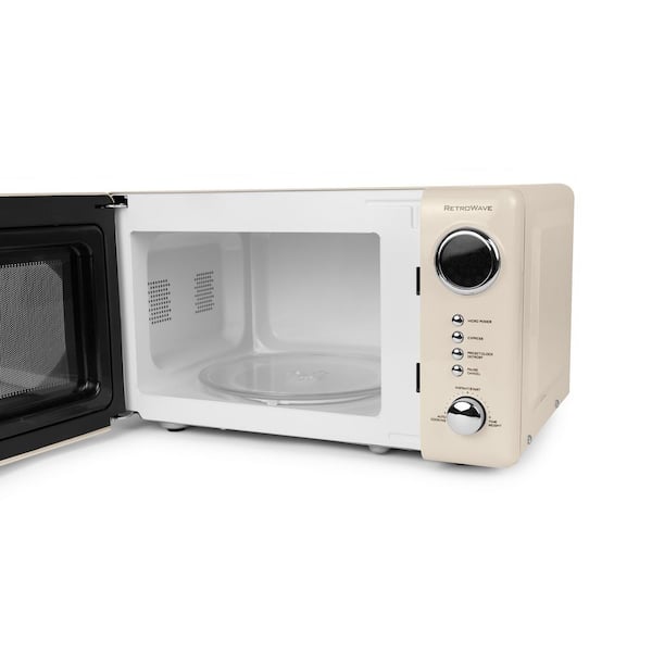 https://images.thdstatic.com/productImages/d65e7360-3f50-434f-9a76-47a119433eb1/svn/ivory-nostalgia-countertop-microwaves-nrmo7ivy6a-1f_600.jpg