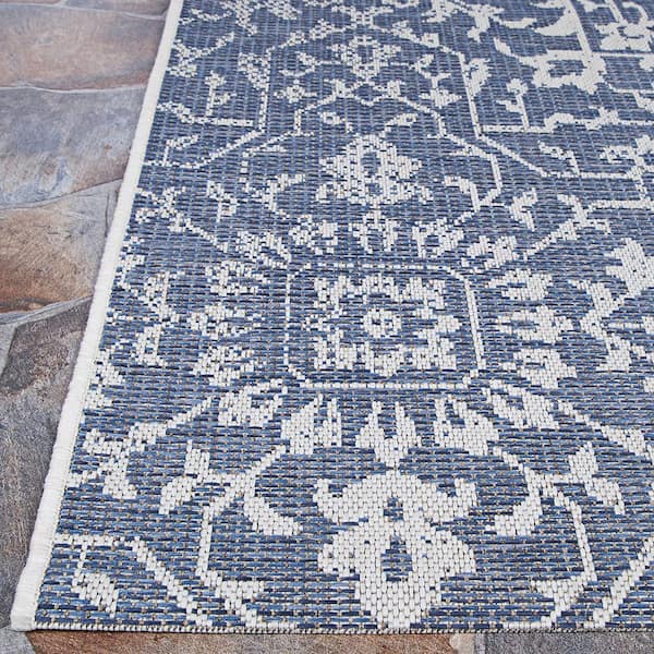 https://images.thdstatic.com/productImages/d661abe1-3a3a-4816-9a7c-1799534f9300/svn/navy-ivory-couristan-outdoor-rugs-23296427510092t-4f_600.jpg