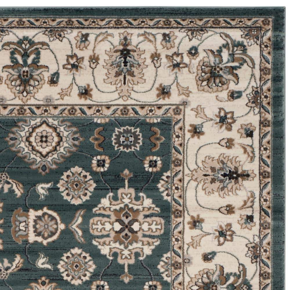 Teal and Cream 9' x 12' Floral Synthetic Area Rug